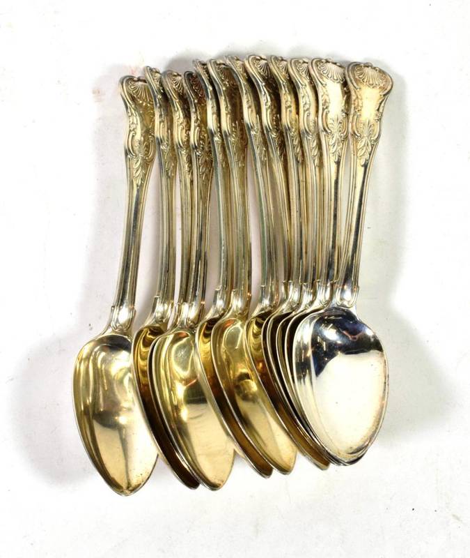 Lot 117 - A set of twelve George III silver King's Honeysuckle pattern tablespoons, William Chawner,...
