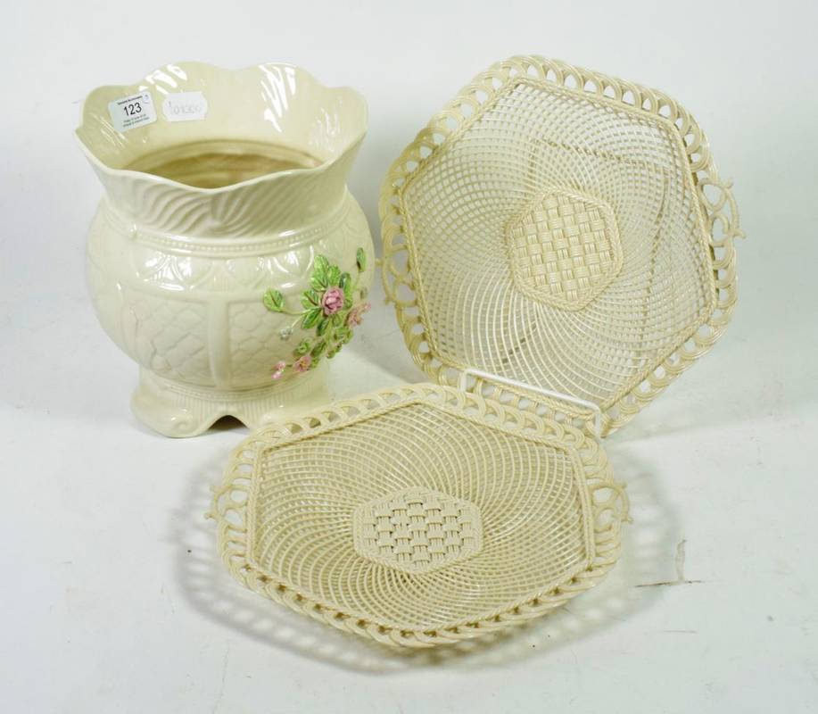 Lot 123 - A Belleek jardiniere; and a pair of basket weave plates (3)