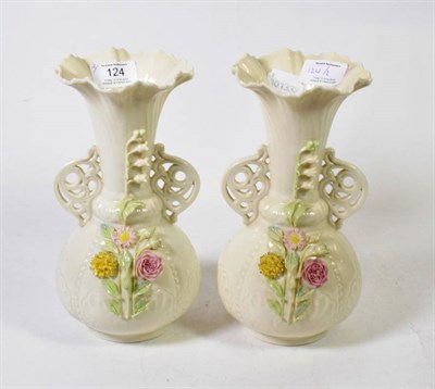 Lot 124 - A pair of Belleek twin handled vases