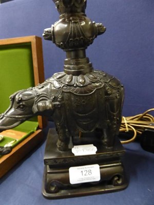 Lot 128 - An Indian bronze candlestick in the form of an elephant (drilled) converted to a table lamp