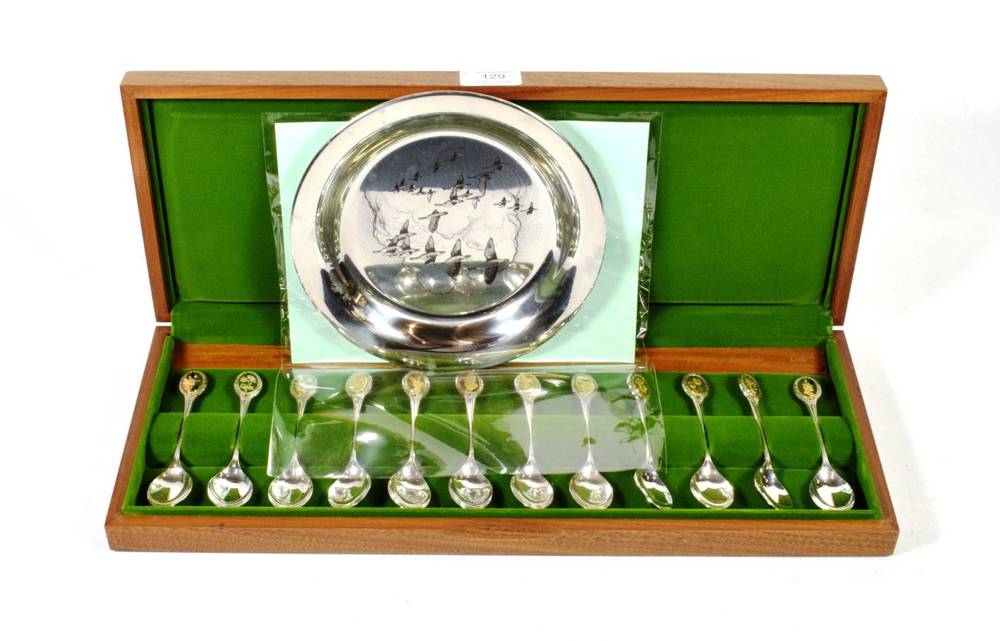 Lot 129 - The Royal Horticultural Society Flower spoons: a set of twelve parcel gilt silver spoons in...
