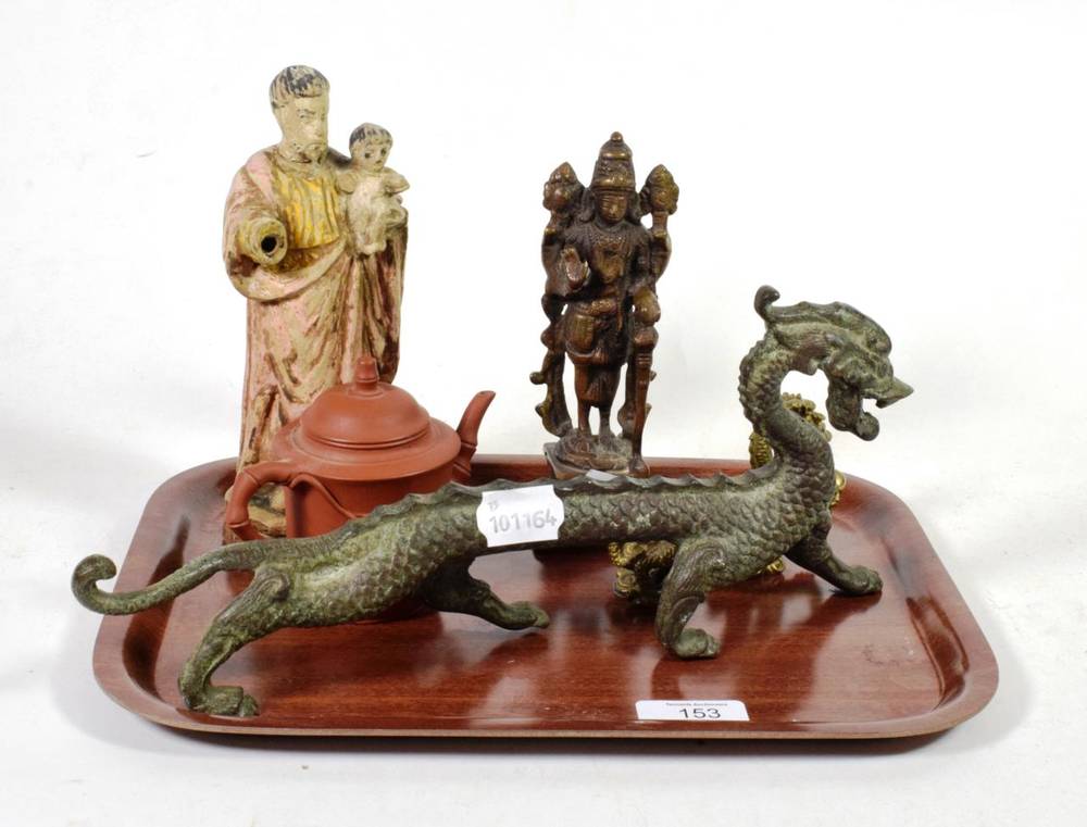 Lot 153 - A Chinese Yi Xing teapot, two Chinese bronze models of dragons, an Indian bronze of a deity and...