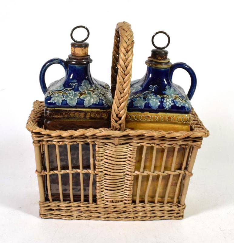 Lot 158 - A pair of 19th century Doulton Lambeth wine flasks in original wicker carrier