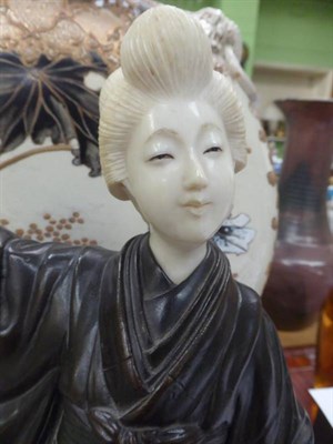 Lot 166 - A Japanese Meiji period bronze and ivory figure of a geisha (a.f.)