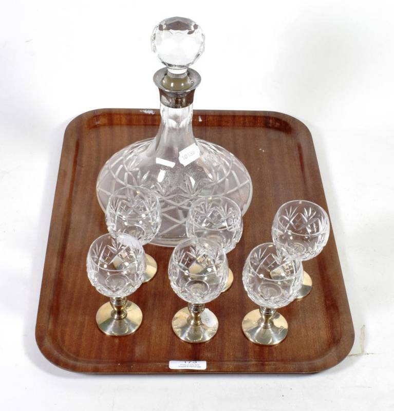 Lot 173 - A silver mounted cut glass ships decanter; and a matching set of six stem glasses