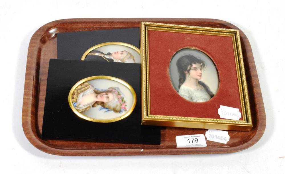 Lot 179 - A pair of portrait miniatures painted on porcelain together with with a larger example (3)