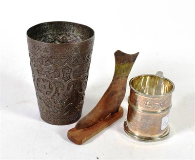Lot 182 - A silver mug; a late 19th century brass beaker; and a fireside ornament in the form of a boot
