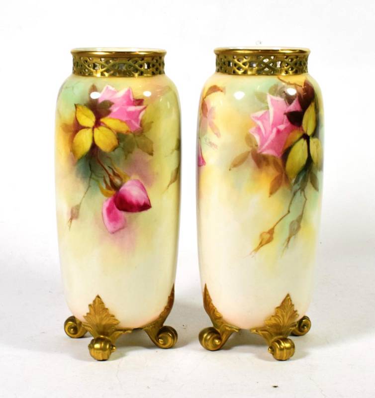 Lot 184 - A pair of Royal Worcester vases, painted with roses and signed Jarman