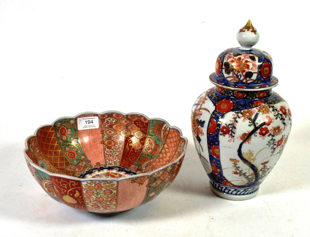 Lot 194 - A 19th century Japanese Imari baluster jar and cover; together with a similar bowl (2)