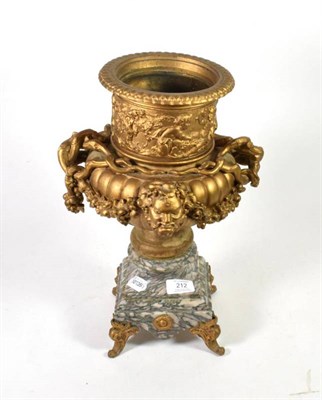 Lot 212 - A 19th century gilt metal vase on marble stand