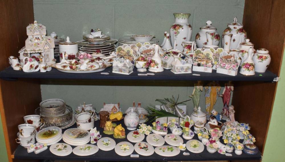 Lot 219 - Two shelves of Royal Albert 'Old Country Roses', Royal Doulton and Coalport floral encusted...