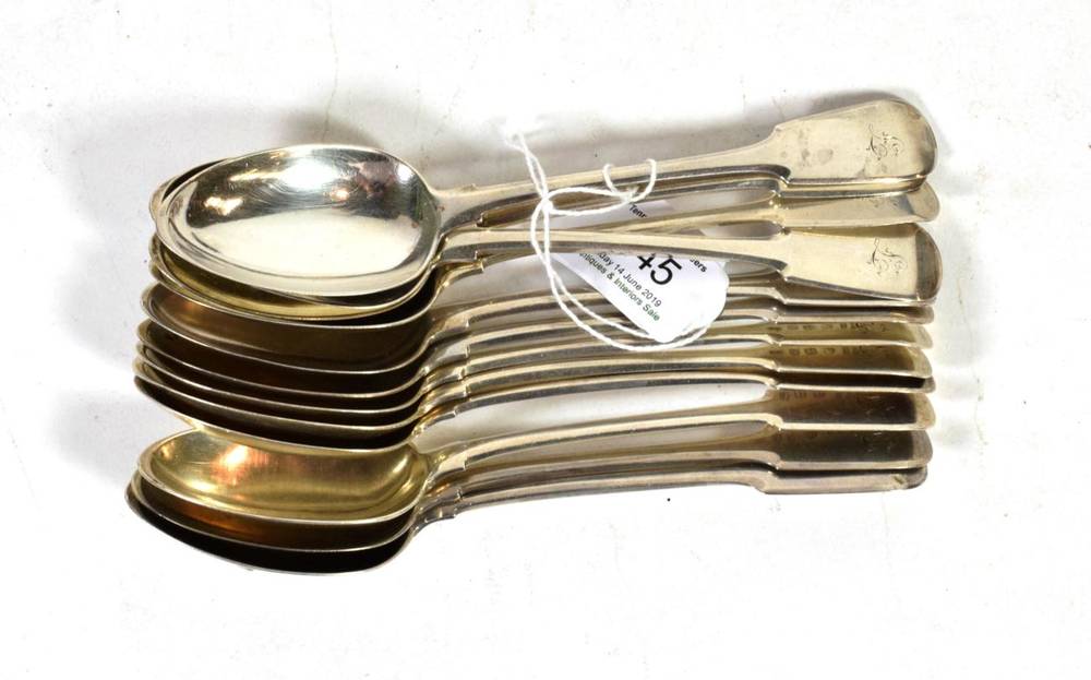 Lot 245 - A set of twelve Scottish Provincial silver fiddle pattern dessert spoons, William Jamieson,...