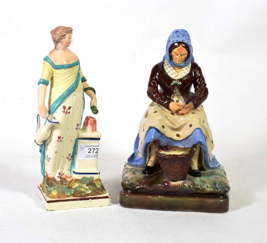 Lot 272 - A Continental Majolica-style figure of fishwife; and a pearlware pottery figure of the goddess...
