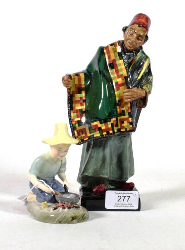Lot 277 - A Royal Doulton figure ''The Carpet Seller'' HN1464; together with a Royal Doulton figure...