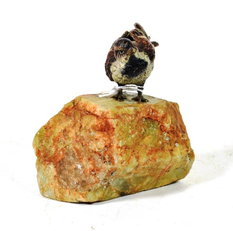 Lot 285 - A cold painted bronze of a bird on a naturalistic marble base
