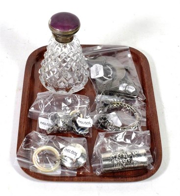 Lot 293 - A silver and guilloche enamelled stop perfume bottle; with rattles, purses etc (8)