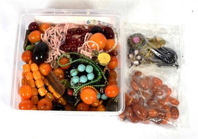 Lot 300 - A box of amber and amber coloured bakelite beads and other costume jewellery