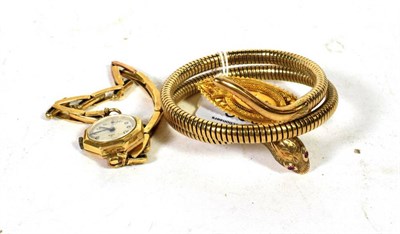 Lot 306 - A 9 carat gold sprung snake bracelet; a brooch stamped '9CT', length 4.7cm; and a lady's wristwatch