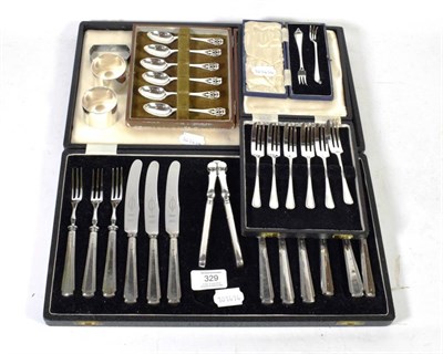 Lot 329 - Cased silver flatware including six pairs of fruit knives and forks, six cake forks, six tea...