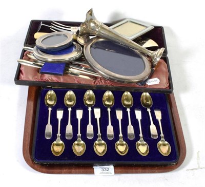 Lot 332 - A set of twelve silver fiddle pattern teaspoons, Henry Williamson, Sheffield 1910, in a fitted...