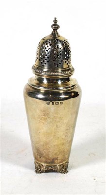 Lot 352 - A silver caster, Barker Bros, Birmingham 1940, with pull off cover, on decorative bracket feet,...