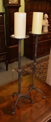 Lot 374 - A pair of wrought iron candle stands