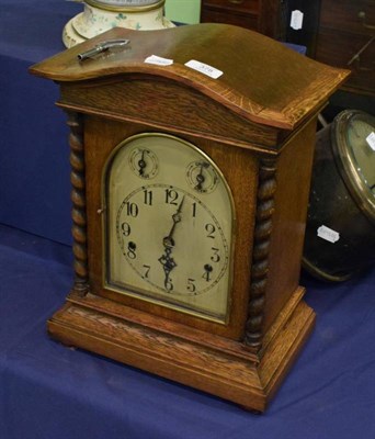 Lot 378 - An oak cased chiming table clock, triple spring barrel movement chiming on five gong rods