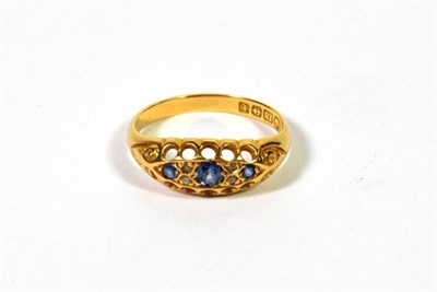 Lot 390 - An 18 carat gold sapphire three stone ring, finger size M