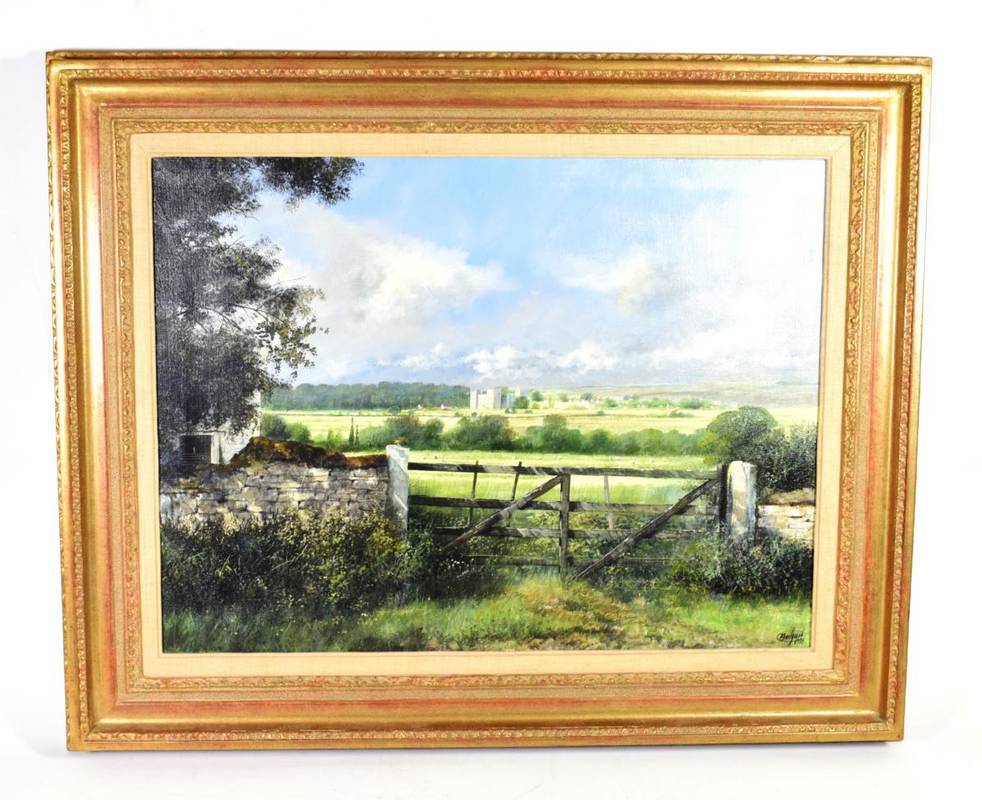 Lot 1005 - Clive Madgwick (1934-2005) A castle in a sun bathed landscape (possibly Castle Bolton), signed...