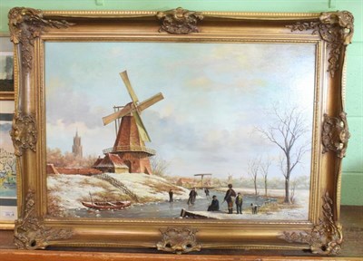 Lot 1015 - Pieter Cornelis Steenhouwer (1896-1972) Dutch, Figures skating on frozen canal before windmill,...