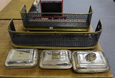 Lot 1108 - Two brass framed pierced fenders; together with three silver plated entree dishes