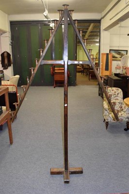 Lot 1110 - Ecclesiastical pitch pine A-frame candle holder, with brass and copper sconces