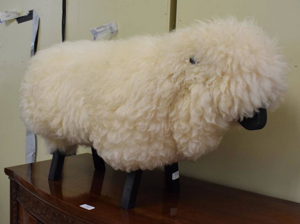 Lot 1120 - An ebonised wood and wool model of a sheep in the manner of Lalanne