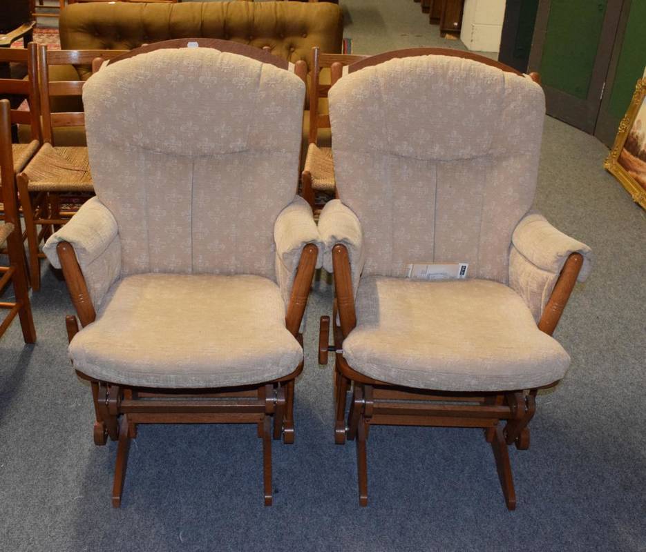 Lot 1131 - Two multi position Dutailier chairs