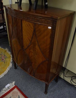 Lot 1142 - A reproduction bow fronted cabinet