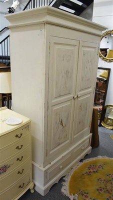 Lot 1143 - White painted pine wardrobe, the base fitted two drawers