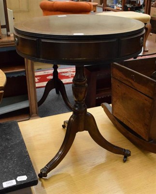 Lot 1149 - A reproduction Regency style drum side table with drawers