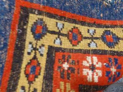 Lot 1168 - An Amristar Indian carpet, the shaded indigo field with an allover design of flowerheads...