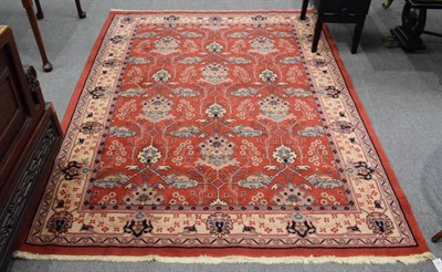 Lot 1179 - A machine made rug of Arts & Crafts design, 233cm by 175cm