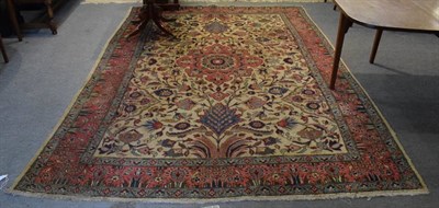Lot 1183 - A Tabriz rug, the ivory field with central medallion surrounded by flowering vines enclosed by...