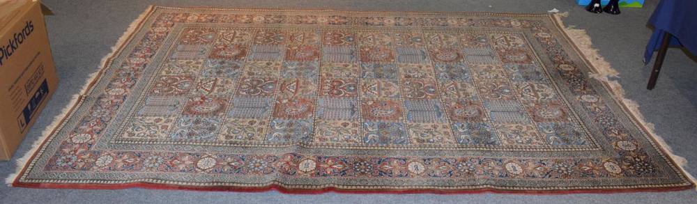 Lot 1188 - Ghom Carpet, Central Iran, circa 1950, the polychrome compartmentalised field of trees birds...