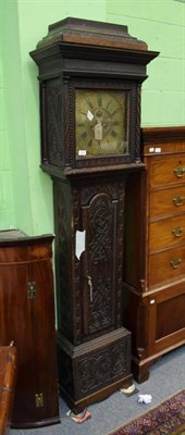 Lot 1213 - ~ A carved oak eight day longcase clock, brass dial with chapter ring signed E Harman,...