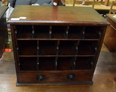 Lot 1225 - A pigeon hole table top cabinet chest
