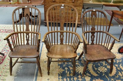 Lot 1234 - Three 19th century Windsor armchairs with spindle legs