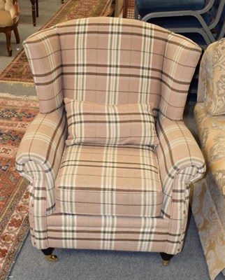 Lot 1243 - Modern wingback chair in plaid upholstery