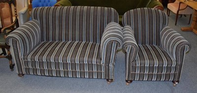 Lot 1245 - An Edwardian drop arm sofa and chair (2)