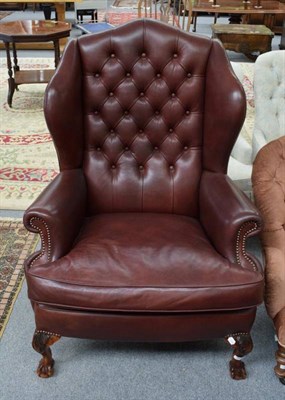 Lot 1250 - Reproduction button back red leather wing chair