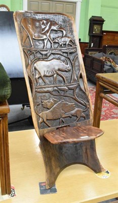 Lot 1270 - An African carved two plank chair