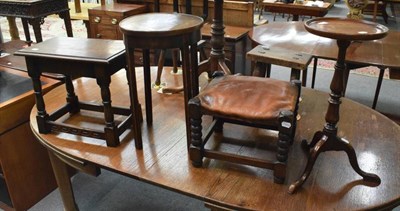 Lot 1275 - An oak wine table; oak stool; leather topped oak stool; and an oak circular occasional table (4)