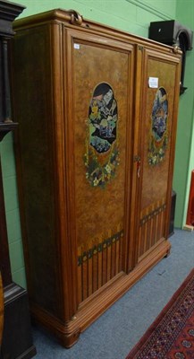 Lot 1288 - An Art Deco Austrian burr walnut armoire, with shaped cornice above two doors each inlaid with...
